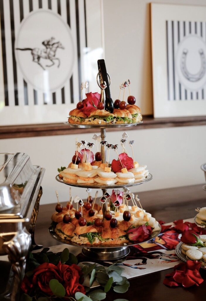 Three-tier tower of croissant sandwiches at a Derby-themed event at The Event Vault