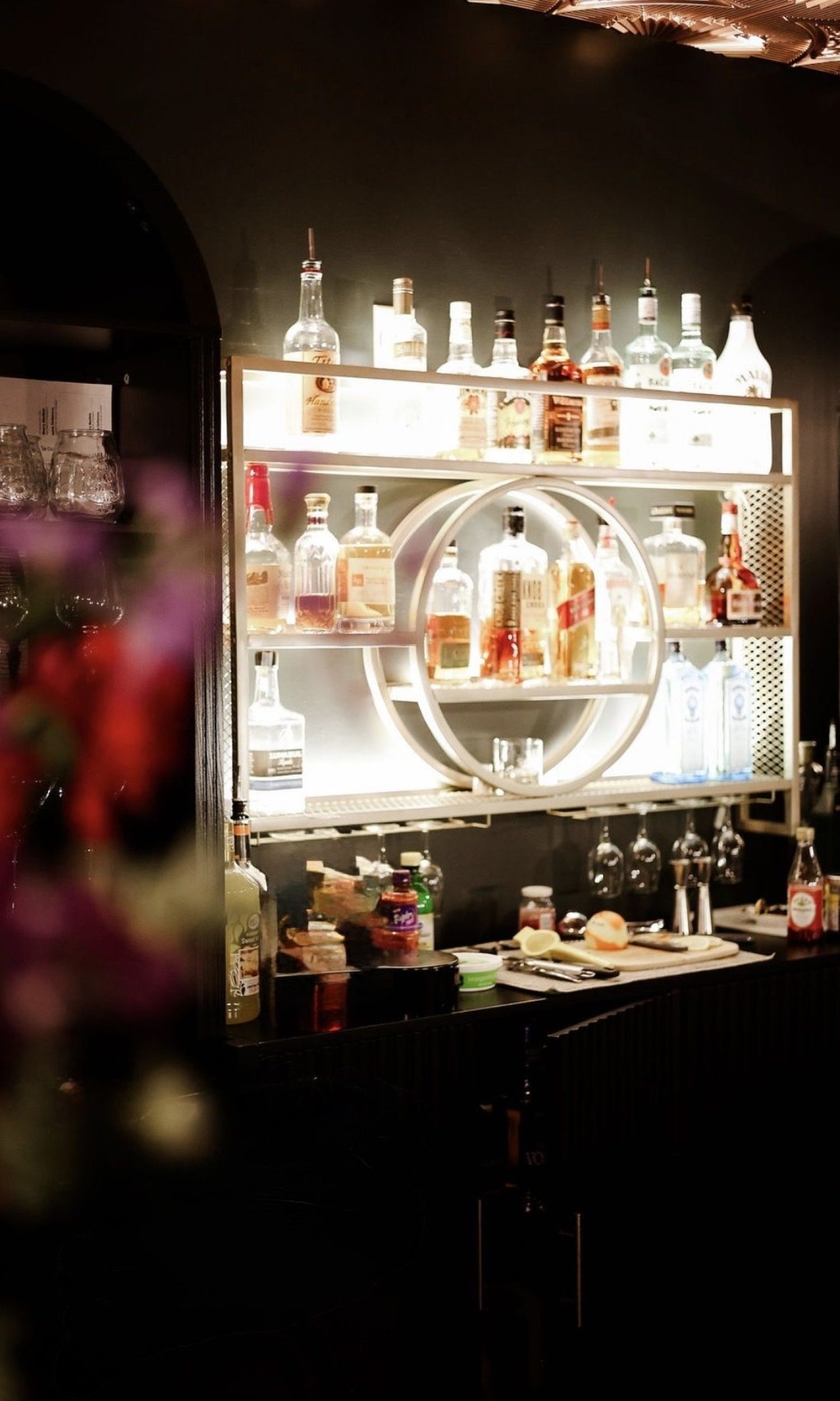 Backlit back-bar display with premium spirits at The Event Vault in Urbana
