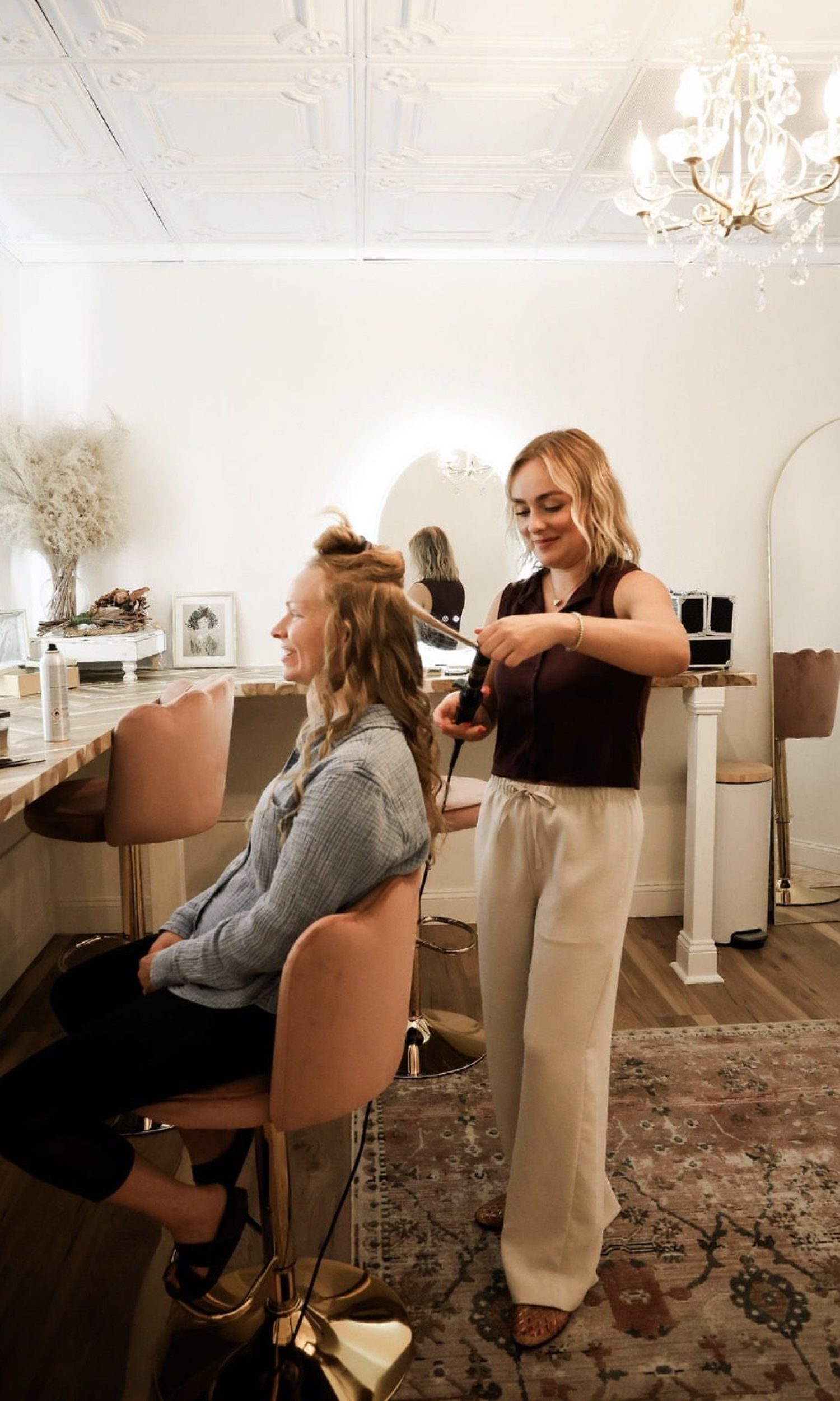 Stylist preparing a bride in the bridal suite at The Event Vault