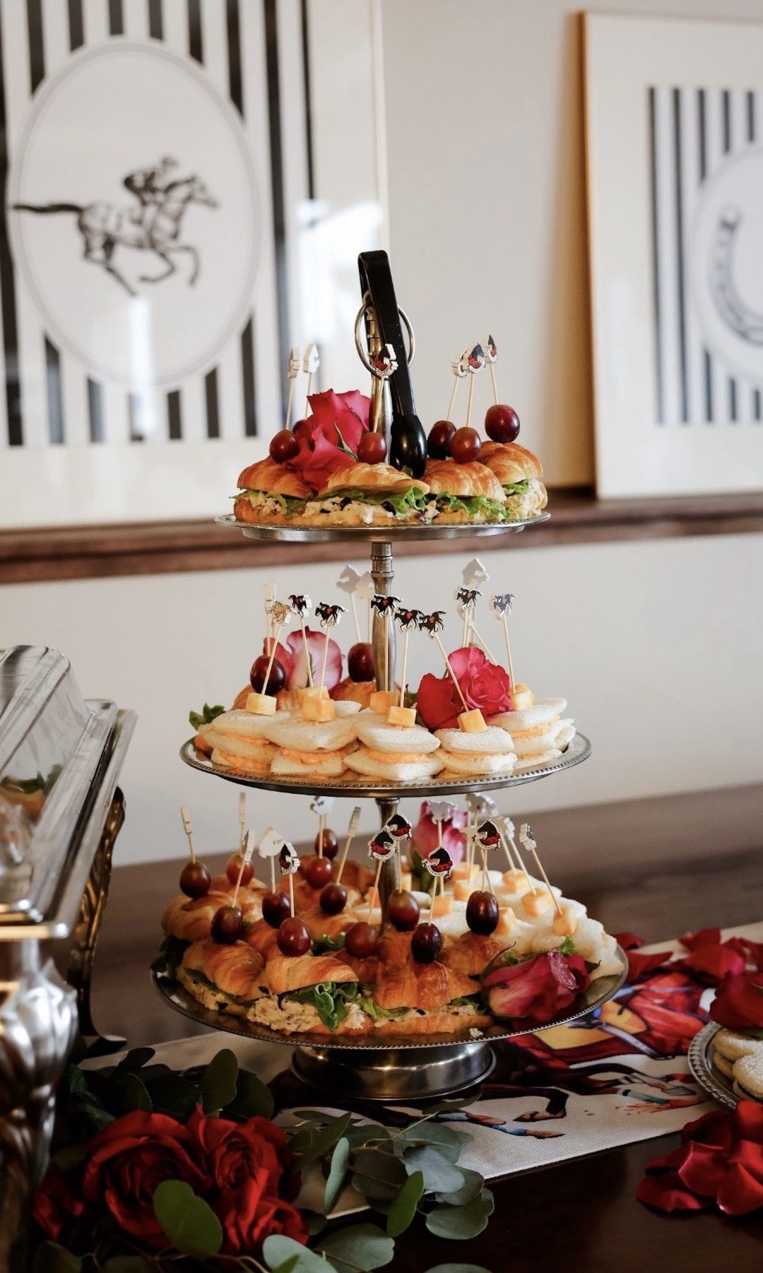 Three-tier tower of croissant sandwiches at a Derby-themed event at The Event Vault