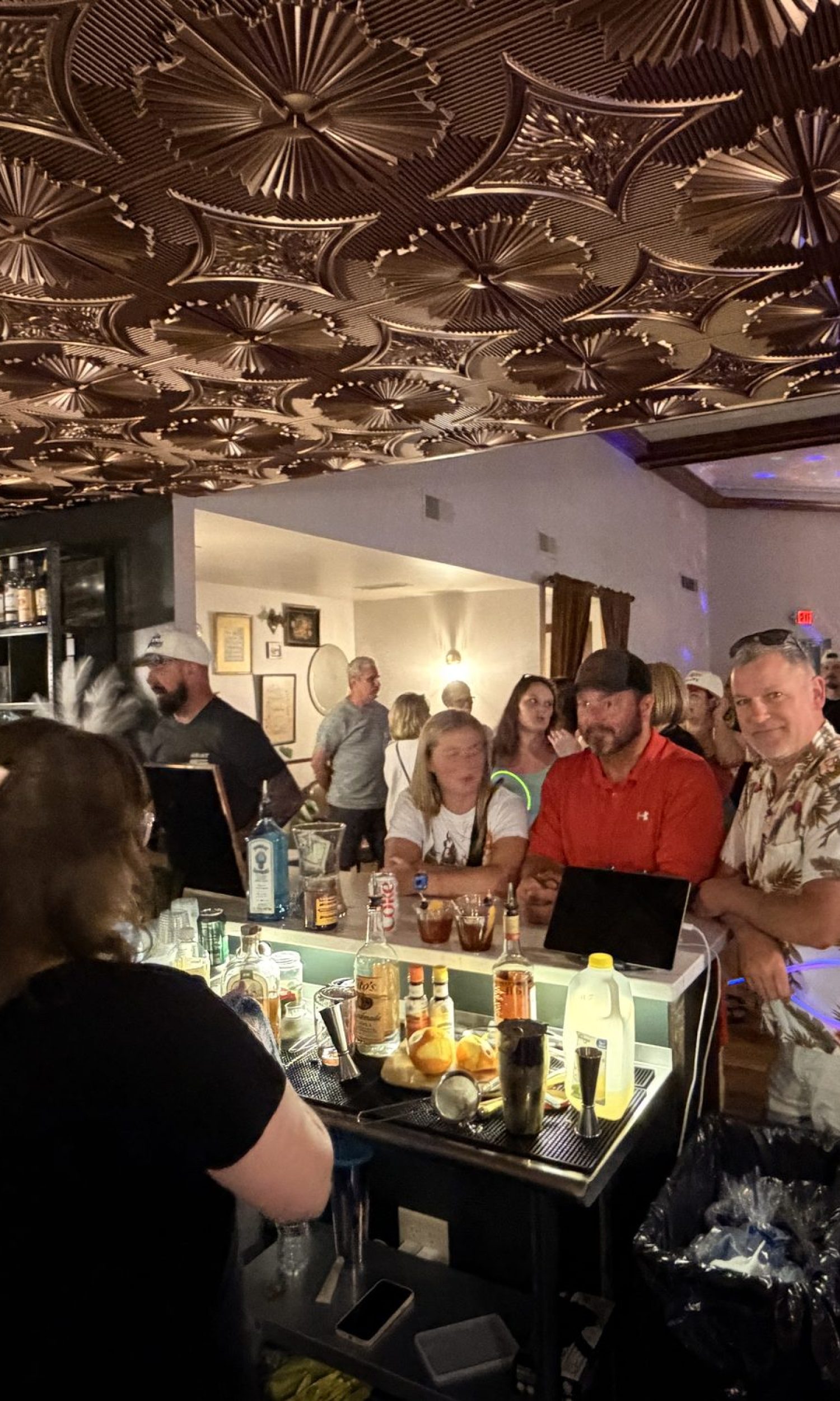 Guests at the bar during a corporate happy hour at The Event Vault