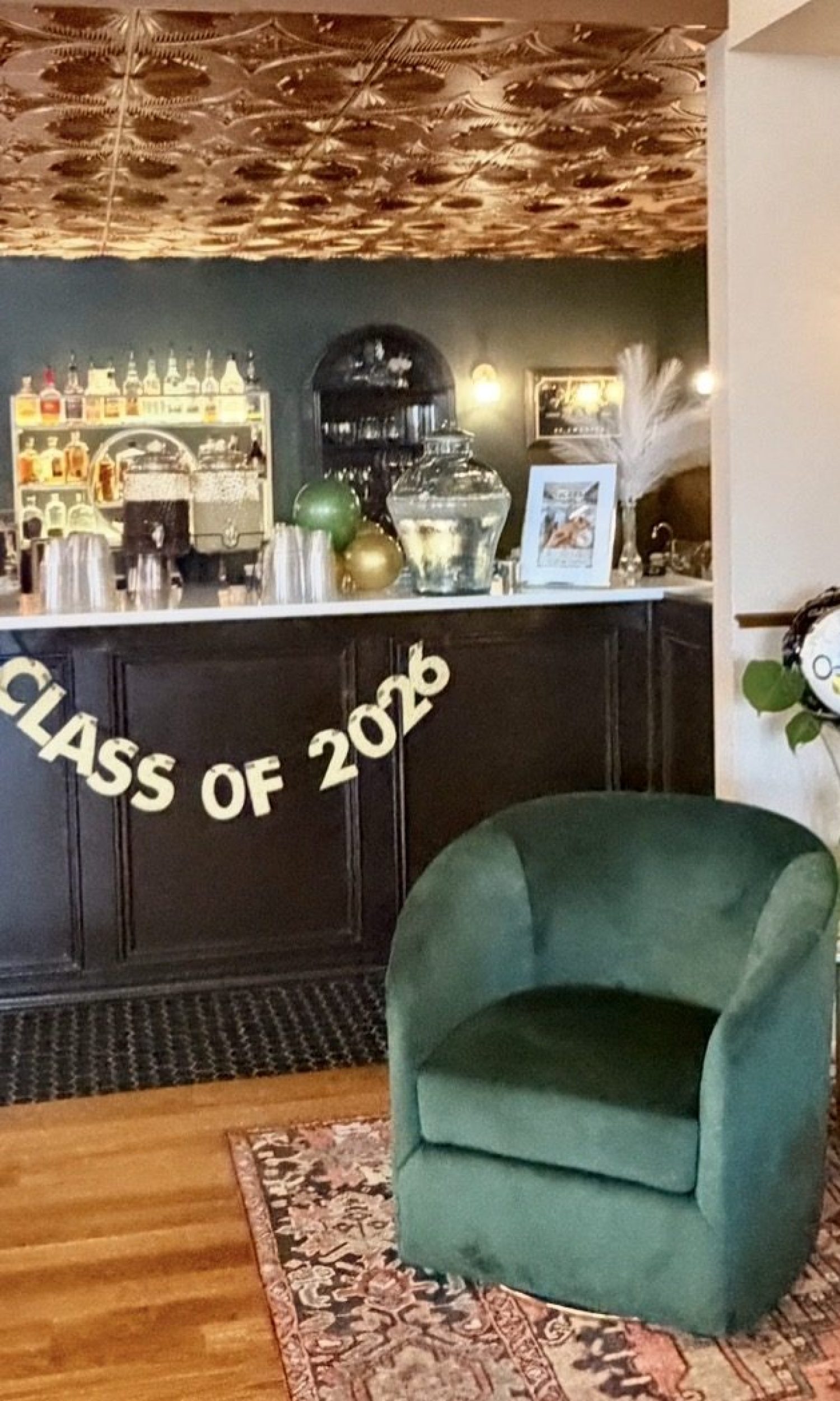 Graduation party setup with Class of 2026 banner at The Event Vault bar lounge
