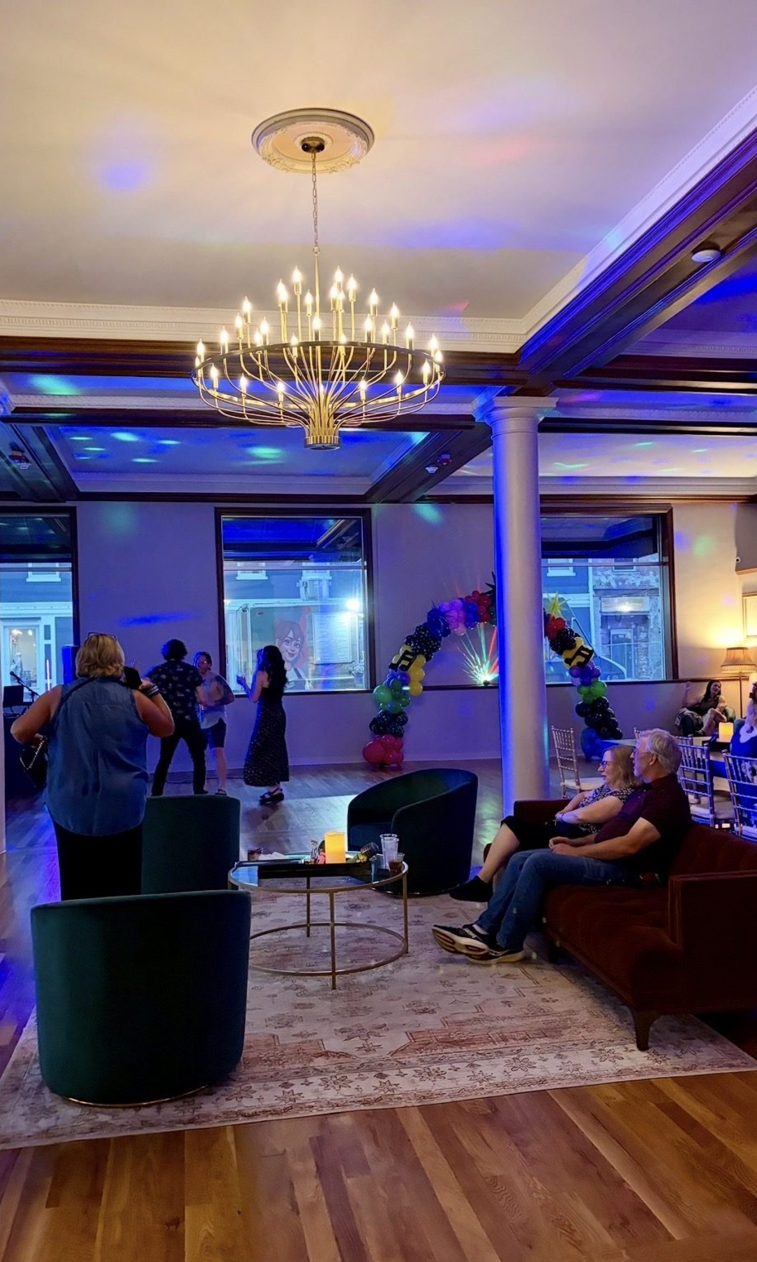 Blue party uplighting and chandelier in the main hall at The Event Vault