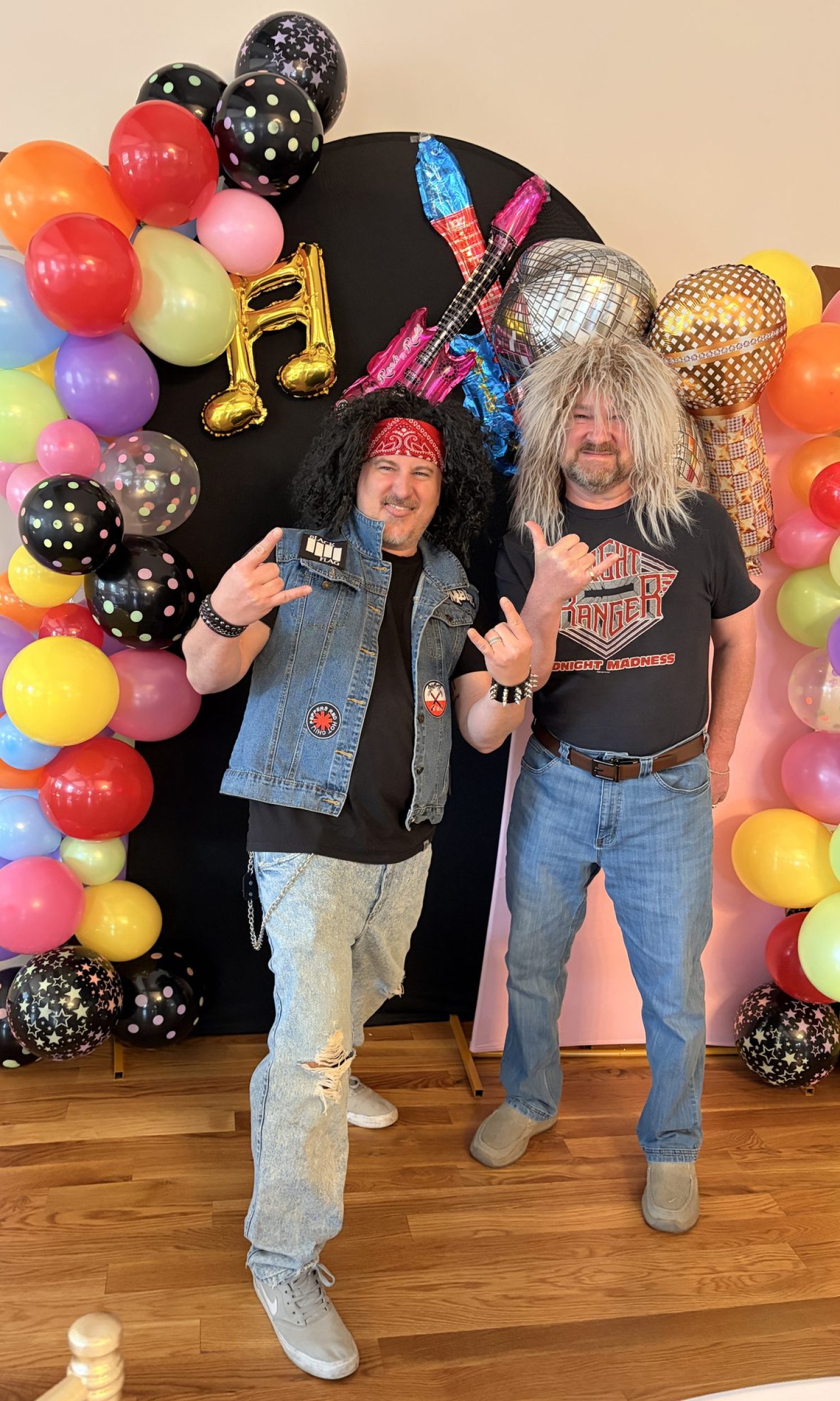 Guests in costume with balloon backdrop at a themed party at The Event Vault